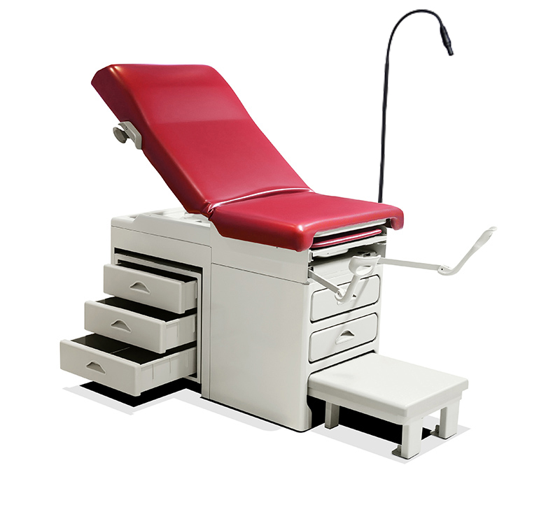 Midmark Ritter similar type manual gynecological table with drawers and lamp